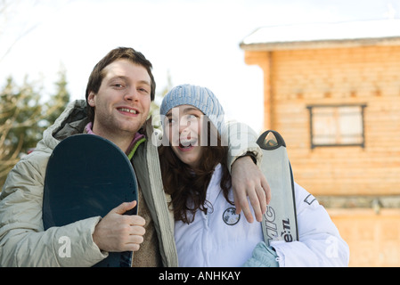 Young skier and snowboarder, smiling, portrait Stock Photo