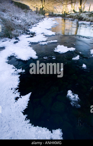 A partially frozen river in Easedale near Grasmere in the Lake District during a cold snap Stock Photo