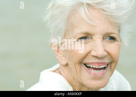 Senior woman smiling, looking away, portrait Stock Photo