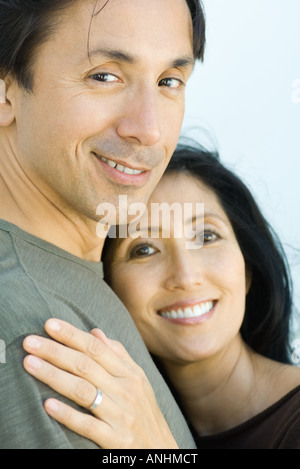 Married couple smiling at camera together, portrait Stock Photo