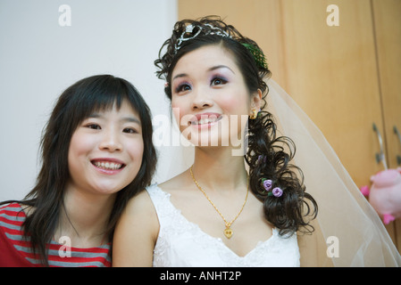 Young woman smiling with bride, head and shoulders, portrait Stock Photo