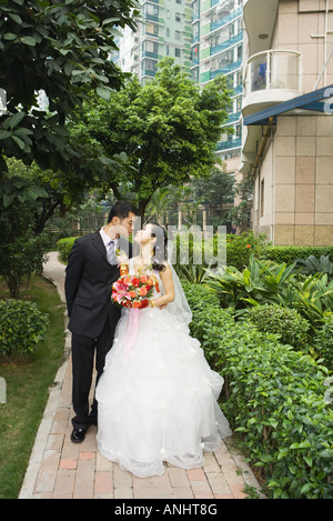 Bride and groom kissing, full length portrait Stock Photo