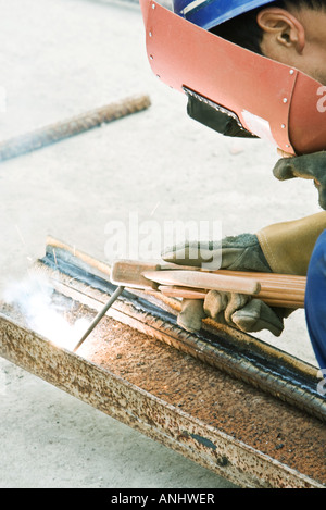 Construction worker working at construction site, close-up Stock Photo
