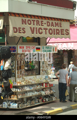 lourdes hautes-pyrenees midi-pyrenees france souvenir shop in lourdes every language spoken in the cause of selling relics Stock Photo