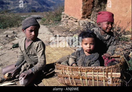 Portrait of three rural boys living in the mountainous Solukhumbu region of Nepal Stock Photo