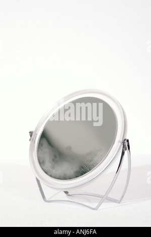 round mirror partially steamed Stock Photo