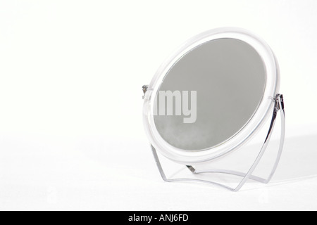 round mirror partially steamed Stock Photo