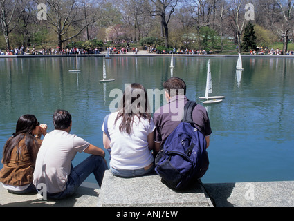 New York City, Central Park spring or summer. Boat Pond, Conservatory Water. Crowd watching toy model boats. Conservancy, Boat Basin, New York, USA Stock Photo