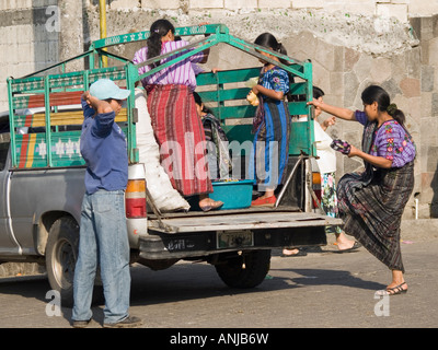 Locals riding in the back of a pick up truck or fletero the local transport Stock Photo