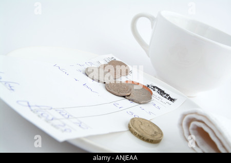leaving a tip in a restaurant Stock Photo