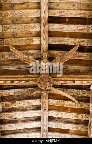 UK Suffolk Blythburgh All Saints Church medieval carved wooden angel roof bosses painted arch braced firred tie beam ceiling Stock Photo