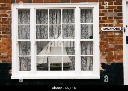 UK Suffolk Southwold East Street model ship in window of Longshore Stock Photo