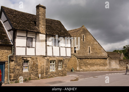 UK Wiltshire Lacock village High Street medieval Tithe Barn at East Street junction Stock Photo