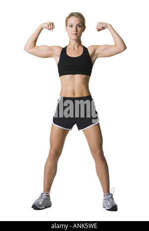 Young Woman Flexing Her Arm Muscles, Dressed In Fitness Clothing, Shot On  White Background. Stock Photo, Picture and Royalty Free Image. Image  18766521.