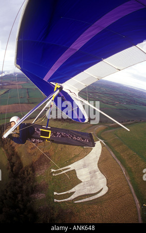 hang gliding over Bratton Camp in wiltshire with Westbury white horse below Stock Photo