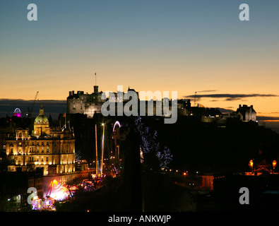 Edinburgh city skyline winter sunset in December with fun fair on the mound, Edinburgh, Scotland, UK, Stock Photo