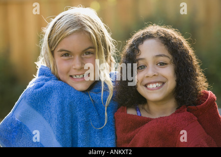 Close up of two girls wrapped in towels Stock Photo