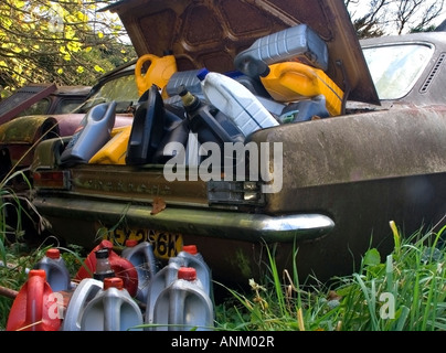 broken car boot overfilled with empty plastic bottles Stock Photo