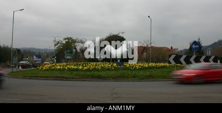 Dorking Roundabout in surrey with daffodils and hen sculpture