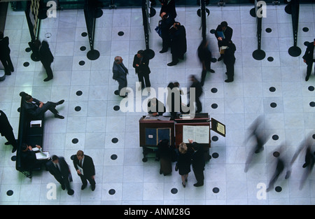 Insurance underwriters brokers and businessmen gather on the floor at Lloyds of London's Richard Rogers headquarters building Stock Photo