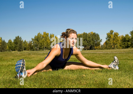 Woman stretching her groin Stock Photo
