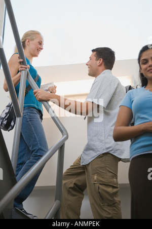 College students talking on stairs Stock Photo