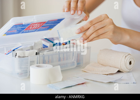 Woman packing first aid kit Stock Photo