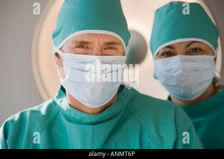 Doctors wearing surgical masks Stock Photo