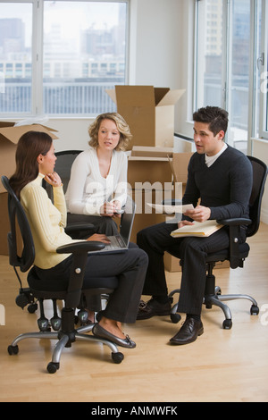 Multi-ethnic businesspeople in new office Stock Photo
