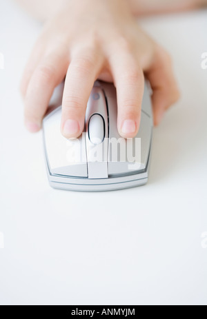 Boy’s hand on computer mouse Stock Photo