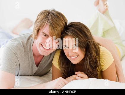 Couple laying on bed Stock Photo