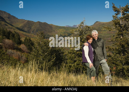 Senior couple hugging outdoors, Utah, United States Stock Photo