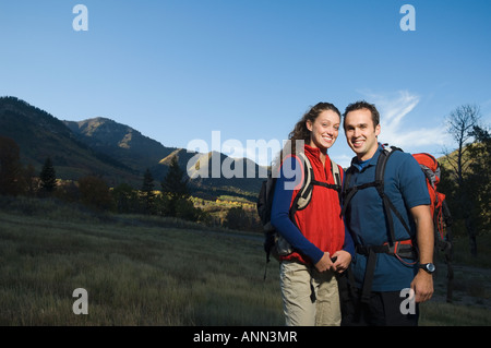 Couple wearing backpacks outdoors, Utah, United States Stock Photo