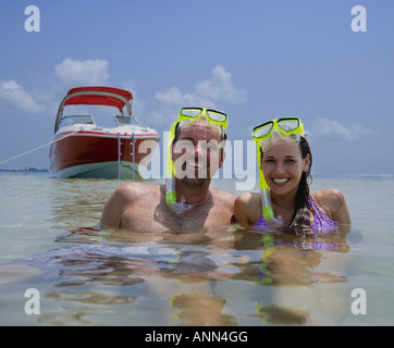 Couple with snorkeling gear in water, Florida, United States Stock Photo