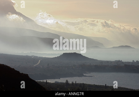 Looking south down the Messenian coast of the outer Mani on a misty morning from between Kardamyli and Stoupa Stock Photo