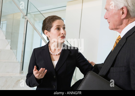 View of businesspeople discussing in an office. Stock Photo