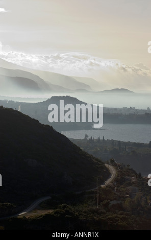 Looking south down the Messenian coast of the outer Mani on a misty morning from between Kardamyli and Stoupa Stock Photo