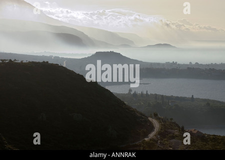 Looking south down the Messenian coast of the outer Mani on a misty morning from between Kardamyli and Stoupa Stock Photo