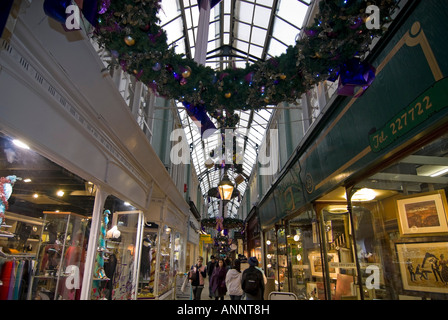 Horizontal wide angle of Morgan arcade the oldest Victorian arcade in central Cardiff decorated at Christmas