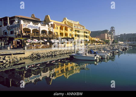 A view of downtown Cabo San Lucas and fishing boats in its small harbor on the Sea of Cortez Gulf Of California, Cabo San Lucas, Mexico. Stock Photo