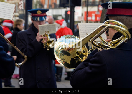 Horizontal close up of a trombone player in a Salvation Army brass band playing Christmas carols to raise money for charity. Stock Photo