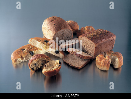 Various breads rolls and loaves on a brushed steel background. Stock Photo