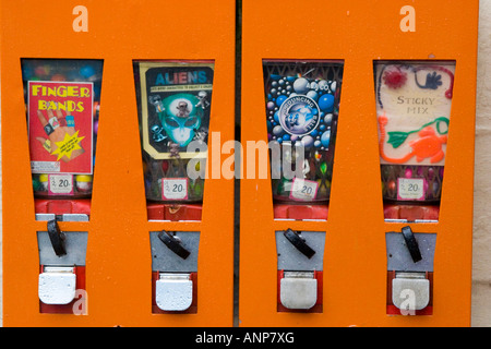 Toy and sweet vending machines with coin operated slots Stock Photo