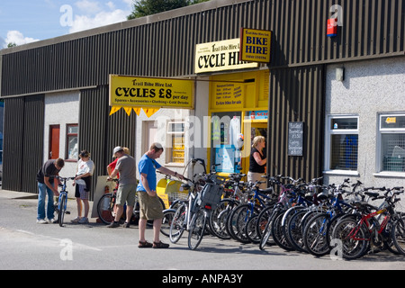Families hiring bicycles outside the bicycle hire shop on the Camel Trail in Padstow Stock Photo