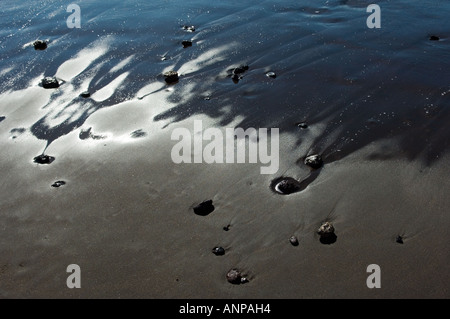 Dark colour of the sand beach of Playa de San Sebastian, La Gomera, Canary Islands, is due to fine particles of black basalt Stock Photo