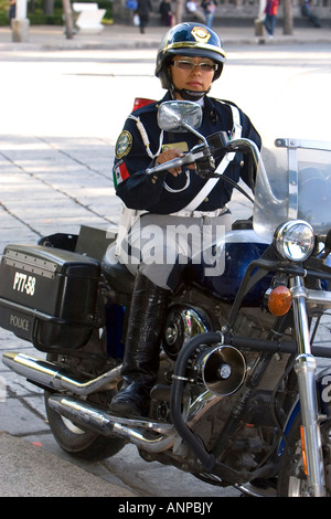 Female police officer riding a motorcycle in Mexico City Mexico Stock Photo