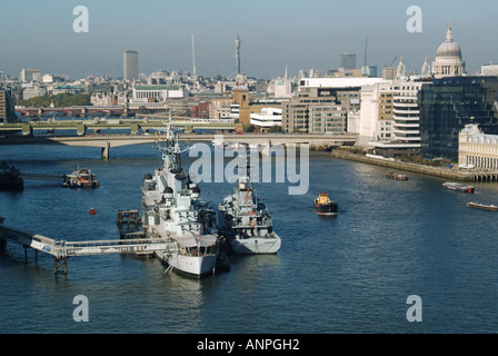 HMS Belfast cruiser moored in the pool of London with visiting River Class Offshore Patrol vessel HMS Tyne alongside Stock Photo