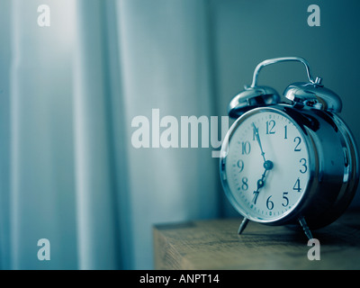 an old fashioned chrome alarm clock Stock Photo