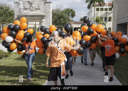 Miami Florida,Overtown,Booker T. Washington High School,campus,public education,campus,state football champions balloons,orange,Hispanic Black African Stock Photo