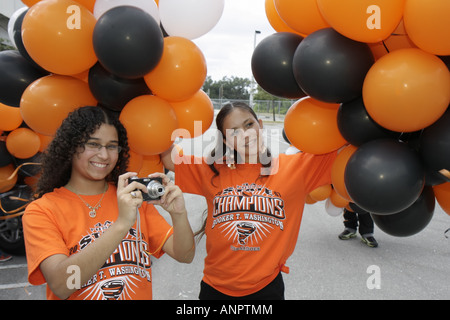 Miami Florida,Overtown,Booker T. Washington High School,campus,public education,campus,state football champions,celebration,balloons,orange,Hispanic L Stock Photo